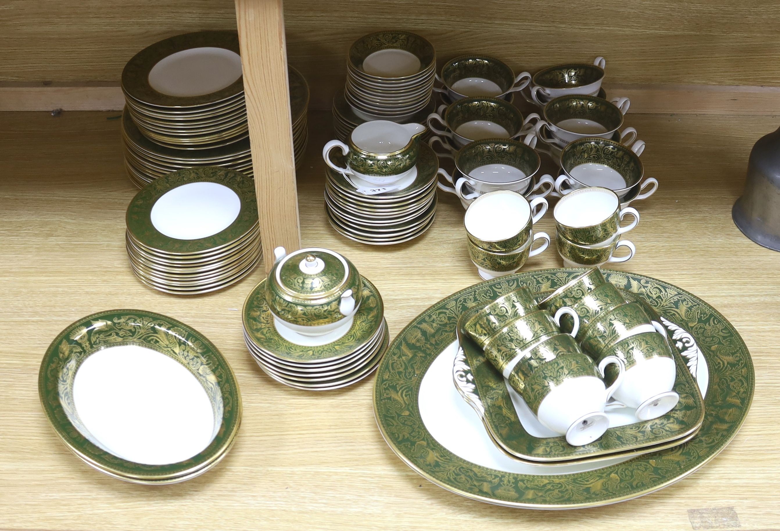 A Wedgwood Green Florentine pattern bone china part dinner and tea service, 110 pieces for a 12 place setting